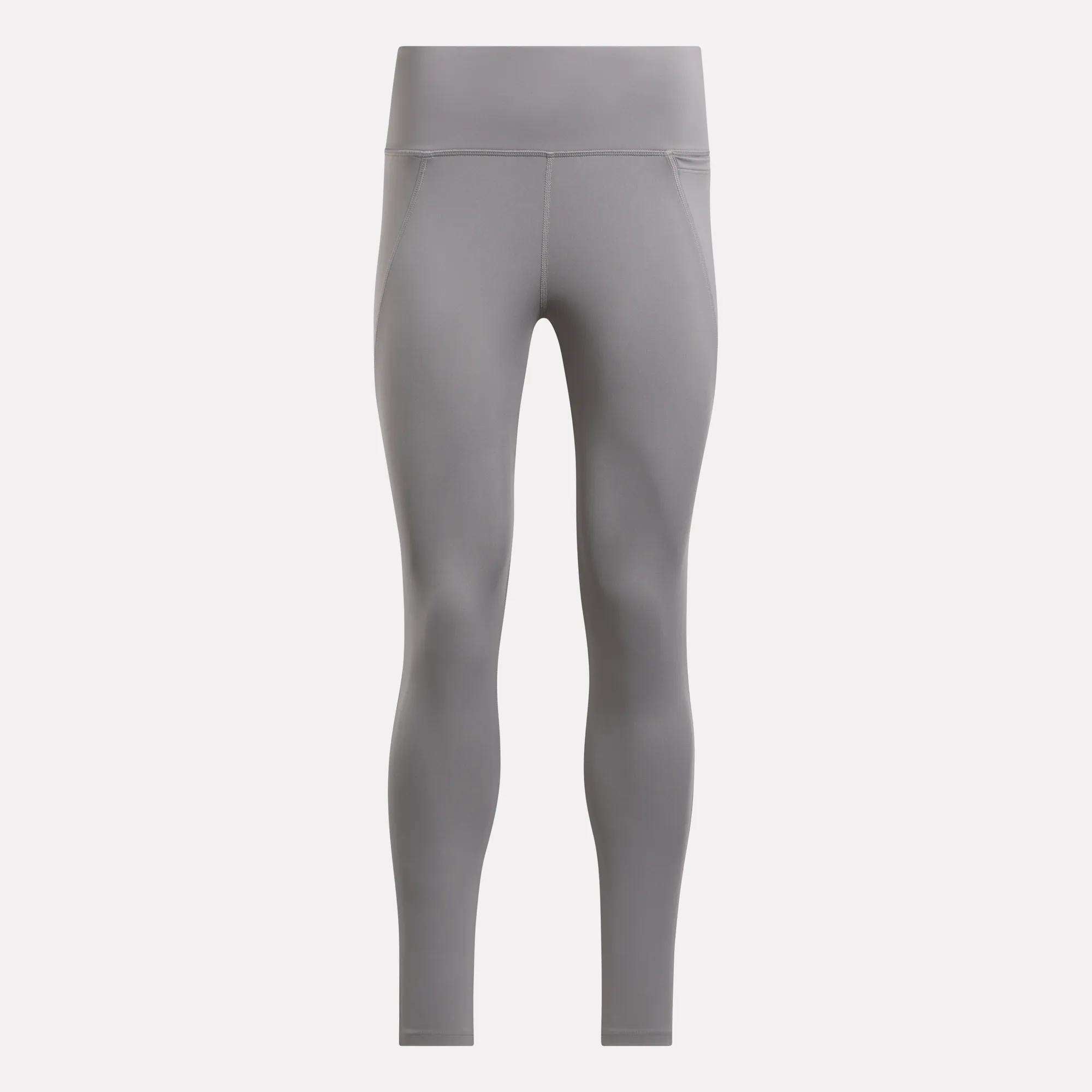 Women's Lux-Lite High-Rise Tights by Reebok in gray, shown front-facing against a plain light background. These full-length leggings feature seam details, RBK-DRY performance fabric, and a smooth high-waisted fit.