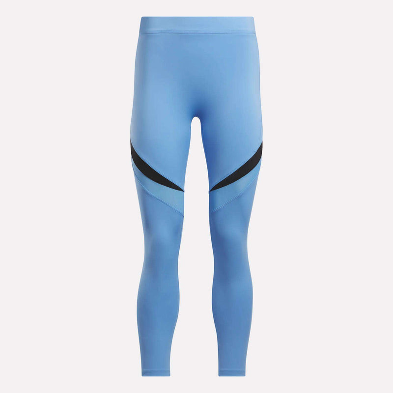Women's Lux High-Rise Colorblock Leggings by Reebok in light blue, featuring black diagonal thigh stripes and sweat-wicking fabric, shown on a plain white background.