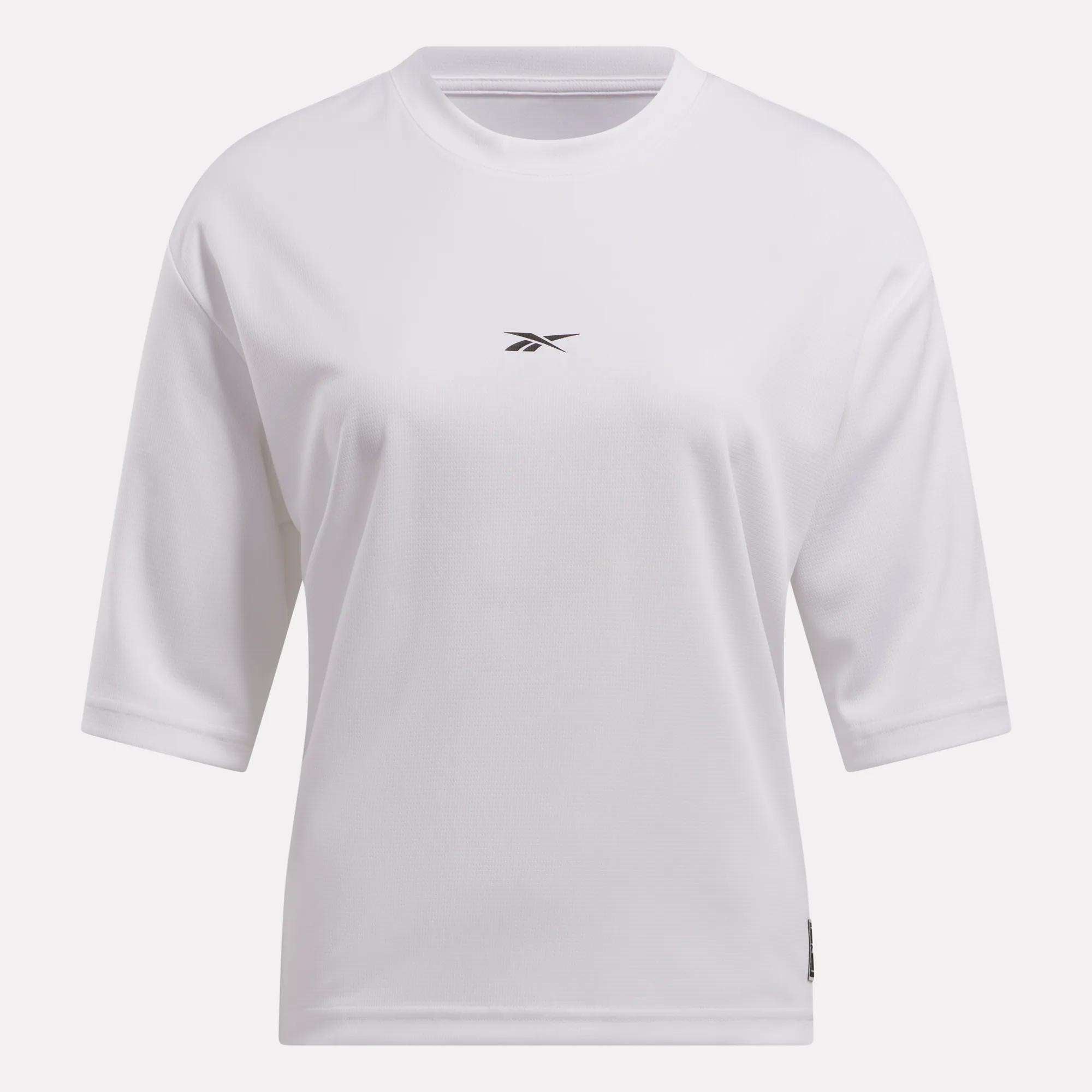The Reebok Women's Basketball Mesh T-Shirt is a plain white crew neck tee with half sleeves and a small black logo centered on the chest, combining classic comfort and sporty style.