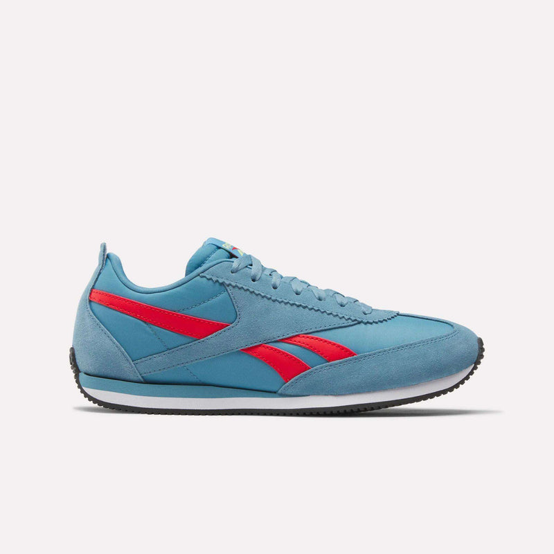 The Reebok R100 Shoes are light blue athletic sneakers inspired by '70s running style, featuring a red Reebok logo, white midsole, and black outsole, shown in side profile on a plain white background.