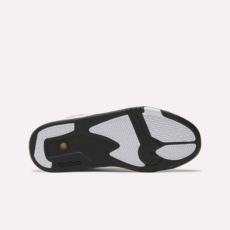 The image displays the sole of Reebok Pump Omni Zone II Shoes, featuring black, white, and grey sections with textured and smooth patterns, visible Reebok branding, and honeycomb details inspired by classic retro basketball sneakers.