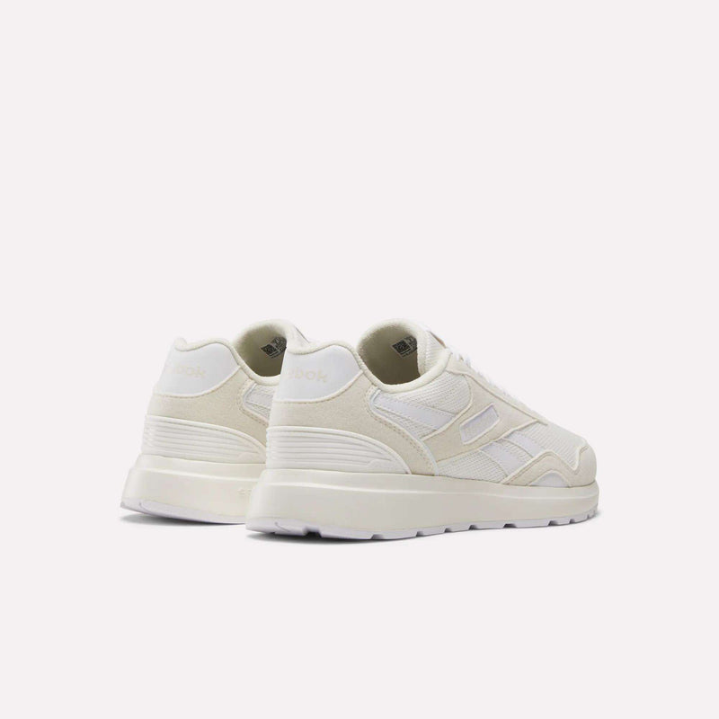 A pair of Reebok Women's GL1100 Shoes in off-white with a retro design, lightweight mesh and suede panels, displayed at an angle to show the back and outer sides against a plain light background.