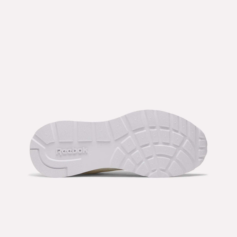 The image displays the white, textured sole of the Reebok Women's GL1100 Shoes viewed from below, showing the tread pattern and embossed Reebok logo—ideal for comfortable, everyday wear.