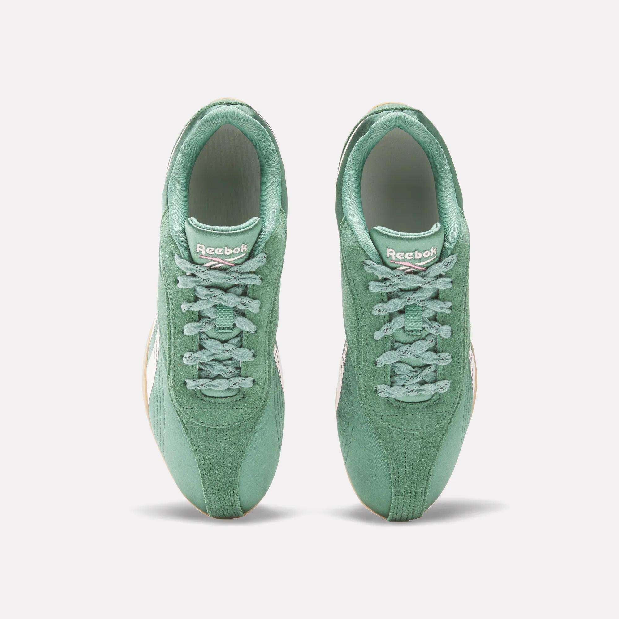 A pair of mint green Reebok Women's Ultra Lo Shoes viewed from above, displaying laces, the Reebok logo on the tongue, and light-colored soles. These low-profile shoes are set against a plain white background.