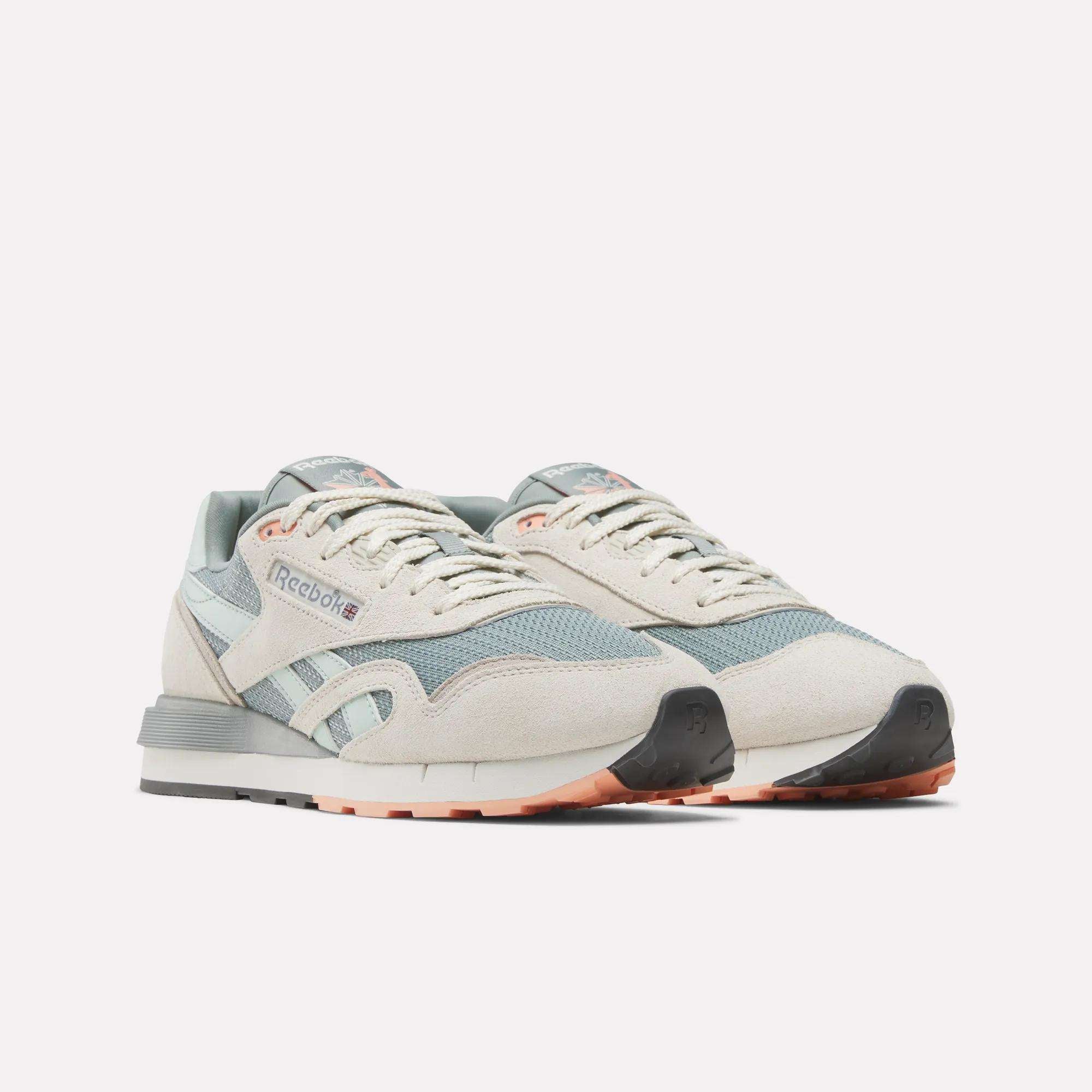 Reebok Classic Nylon 89 Shoes in pastel beige and light blue with white accents, grey soles, and peach details feature a cushioned midsole. Displayed side by side against a plain white background.
