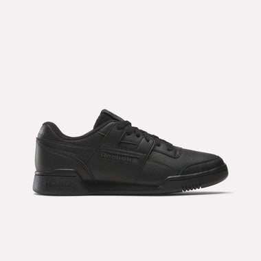 The Reebok Women's Workout Plus Shoes feature a black leather upper, low-top design, lace-up closure, and classic Reebok logos on the side and heel, reflecting iconic '80s fitness style. Shown against a plain white background.