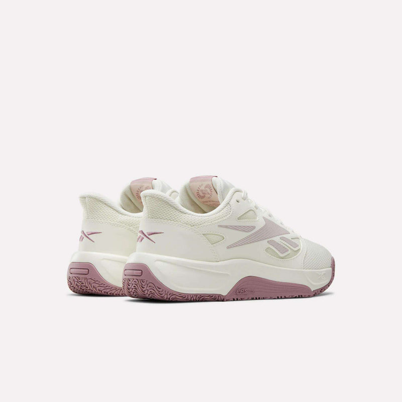 The Reebok Engine LT Shoes are white with lightweight uppers and light pink detailing and soles, shown from the side and back on a plain white background.