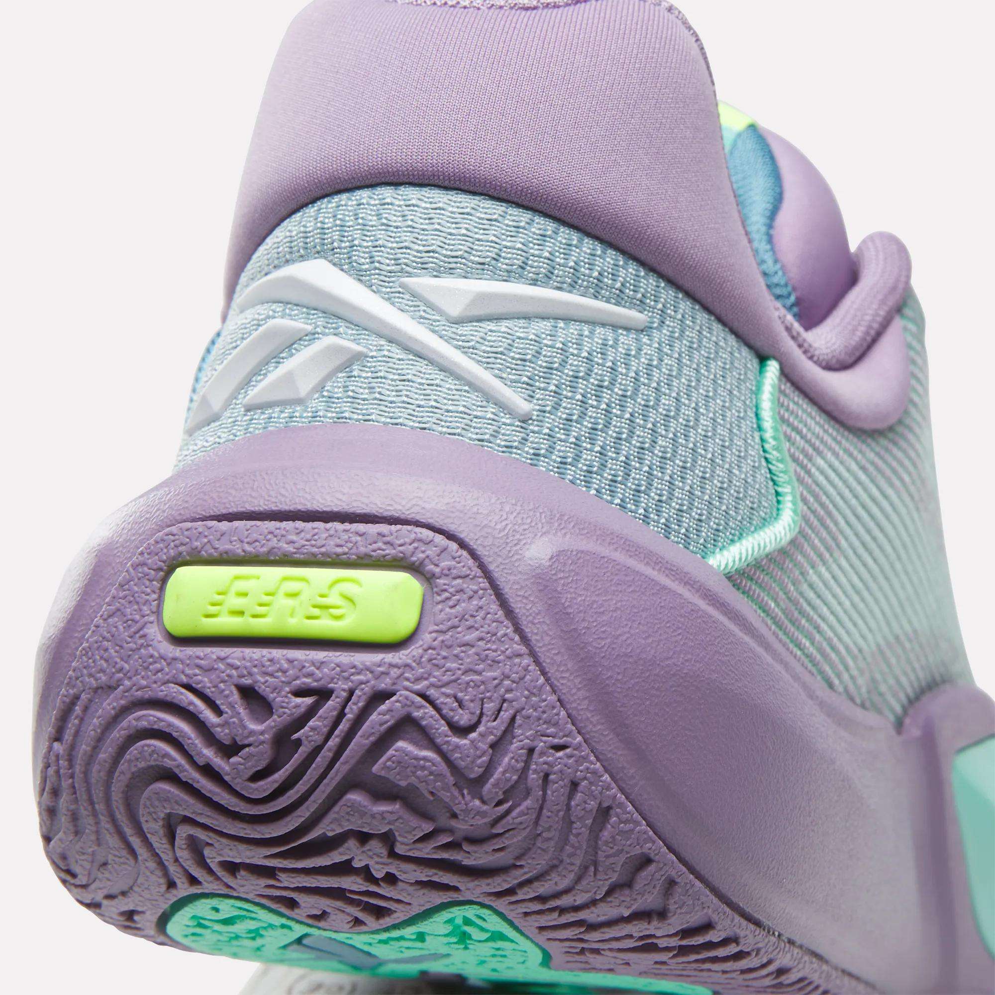 Close-up of the heel of Reebok's Engine A 26 Basketball Shoes in light purple, mint green, and turquoise, showing textured sole for added stability with logo and EER5 on a bright green detail—ideal for basketball.
