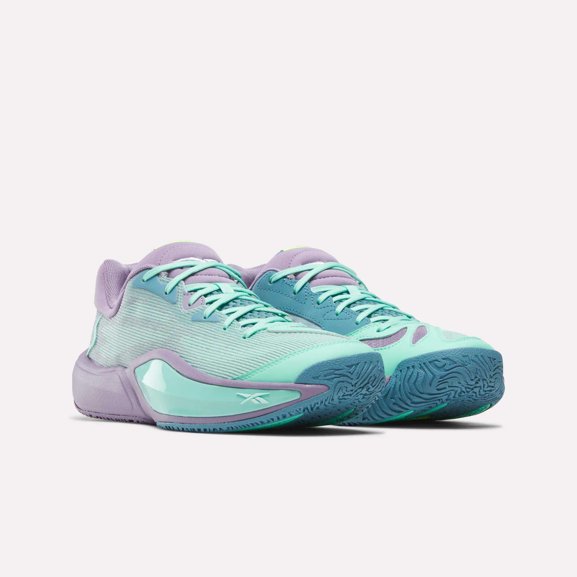 Reebok Engine A 26 Basketball Shoes in pastel teal and lavender, featuring mesh uppers, teal laces, lavender accents, and textured blue rubber soles for stability, displayed on a white background.