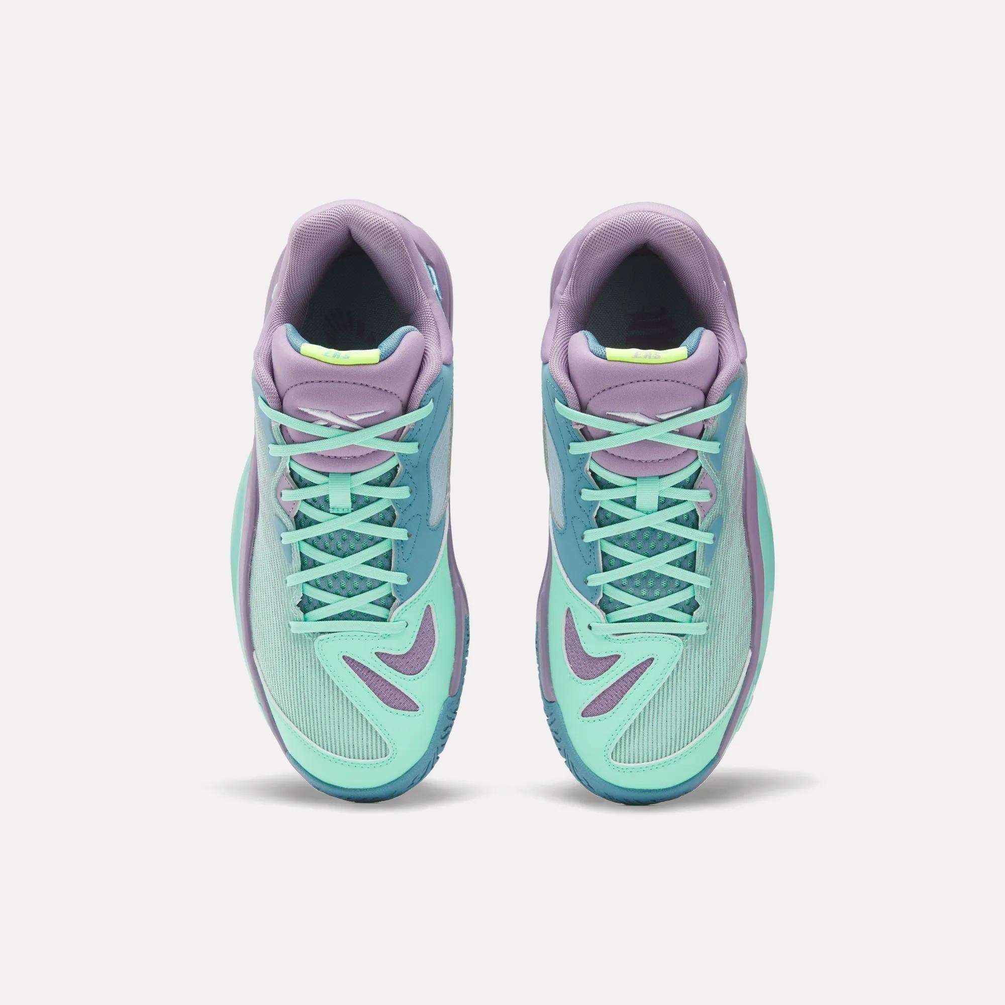 The Reebok Engine A 26 Basketball Shoes showcase a teal and purple design with aqua laces and accents, viewed from above on a white background, offering stability for both on and off the court.