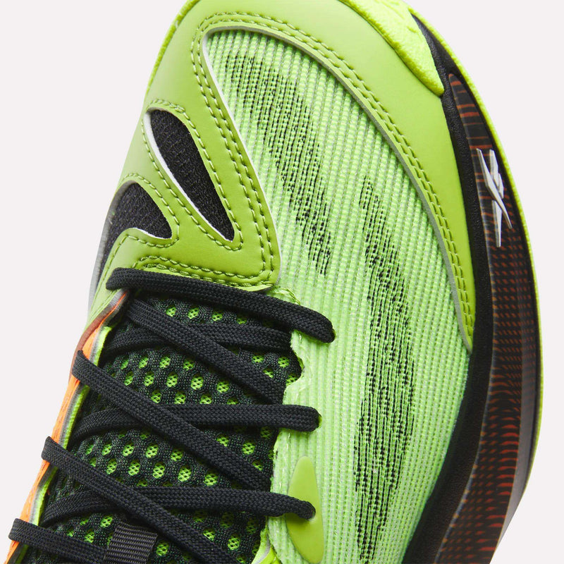 Close-up of Reebok Engine A 26 Basketball Shoes in bright green with black laces, mesh detailing, and textured upper; visible sole and stitching highlight its stability and energy return features.