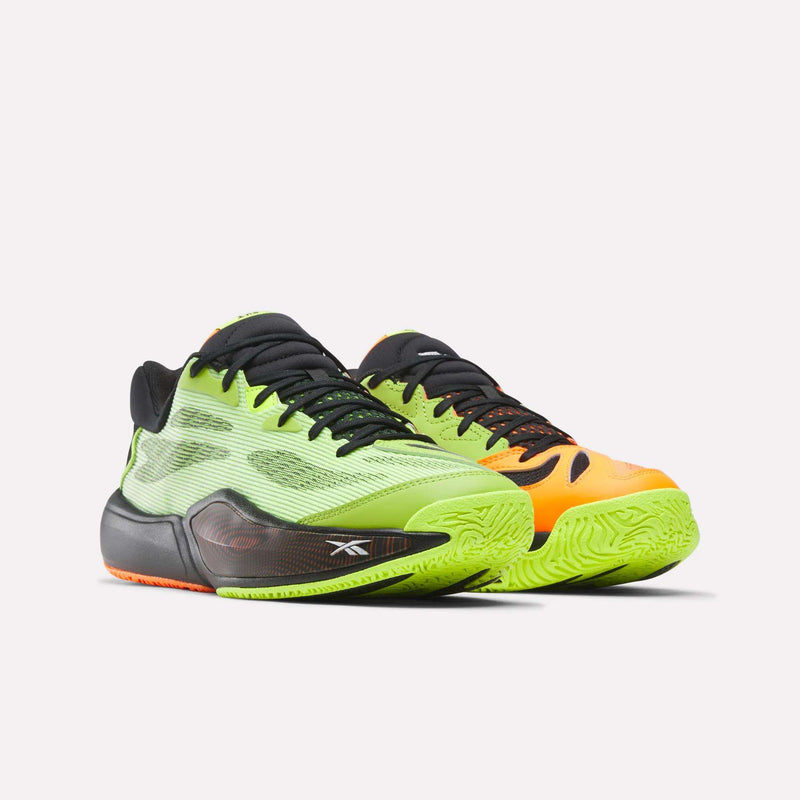The Reebok Engine A 26 Basketball Shoes feature mismatched colors—neon green with black accents on the left, bright orange with black details on the right—and deliver impressive stability and energy return in a stylish, modern athletic design.