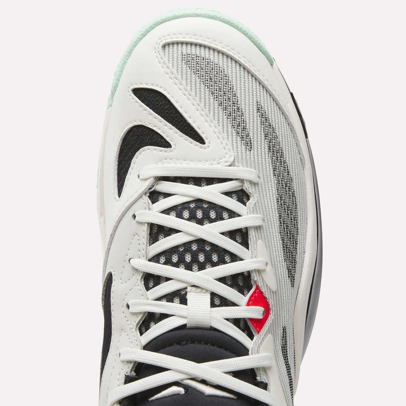 Top view of Reebok Engine A 26 Basketball Shoes with white and black overlays, gray mesh panels for stability, white laces, a small red accent by the eyelets, and a tongue featuring black and white patterned mesh.
