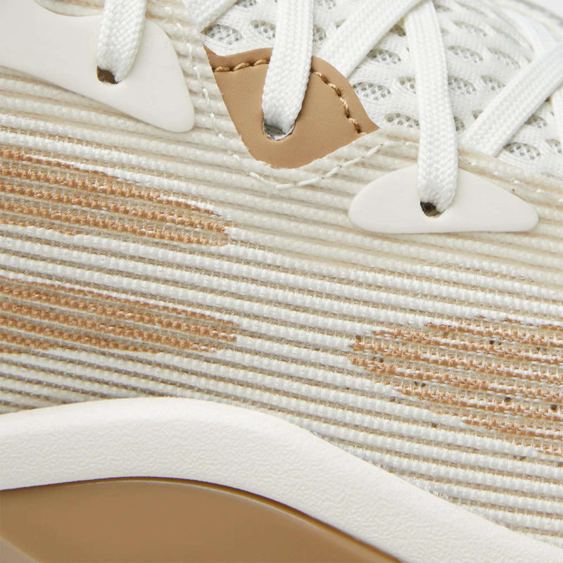 Close-up of the Reebok Engine A 26 Basketball Shoes, showcasing cream and beige striped fabric, white laces, beige and white eyelets, a tan accent near the laces, and textured details inspired by classic basketball shoes.