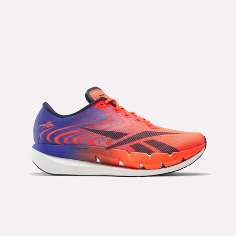 The Reebok SpeedShifter Running Shoes feature a striking bright orange and purple colorway with bold black accents. They are designed with a lace-up closure, a modern aerodynamic silhouette, and unique geometric cutouts. The shoes are completed with a white HyperFloat foam sole for enhanced comfort and style, presented against a plain white background.