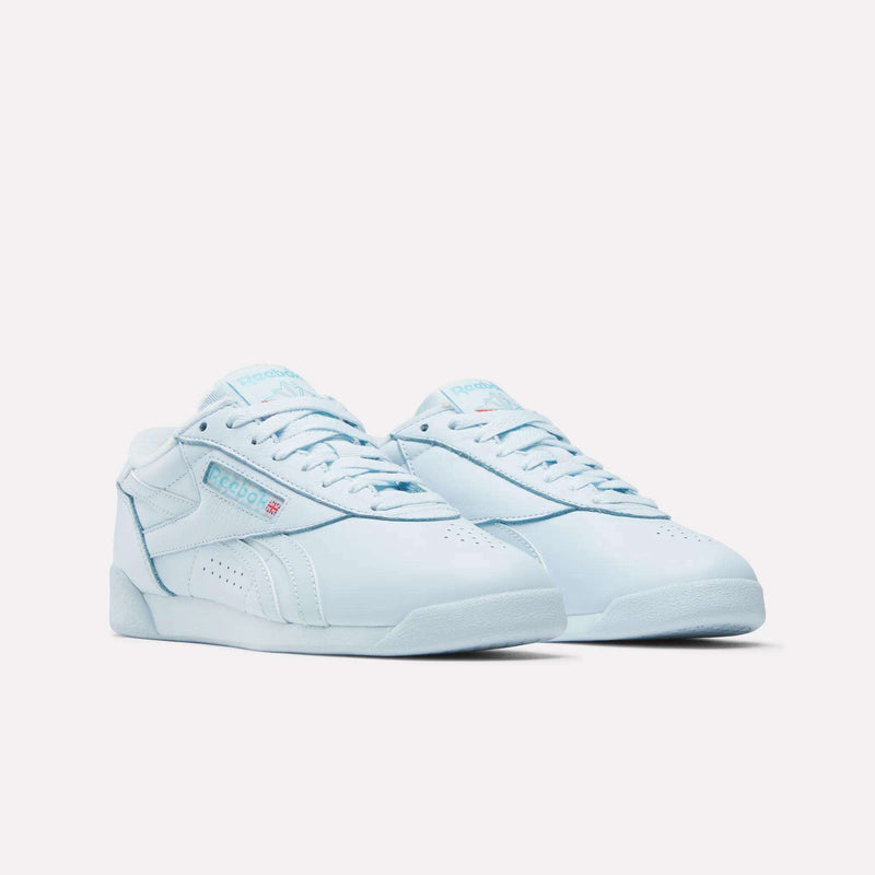 Women's Freestyle Lo Shoes by Reebok in light blue with white soles and the Reebok logo, ideal for everyday wear, shown against a plain white background.