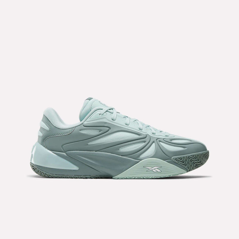 The Angel Reese 1 Basketball Shoes by Reebok feature light teal uppers with textured side panels, a chunky sole with the Energy Return System, and a white Reebok logo near the arch, shown in side profile on a plain white background.