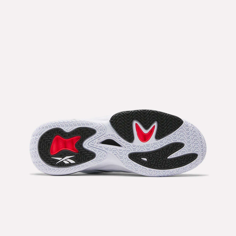 The image shows the sole of the Reebok Angel Reese 1 Basketball Shoes, with black, white, and red rubber, wavy textured patterns, and a white Reebok logo—highlighting nods to performance basketball and Energy Return System technology.