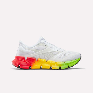The Reebok Women's FloatZig 2 SoleMates Running Shoes feature a white design with a red to green gradient sole and a lightweight foam midsole for comfort, offering optimal performance on your runs. Displayed against a plain background.