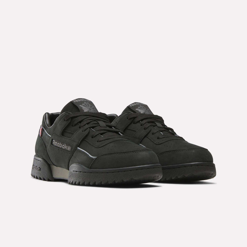 A pair of black Reebok Workout Plus Ripple Shoes, low-top and weather-ready with laces, featuring the Reebok logo on the side and tongue, displayed against a plain white background.