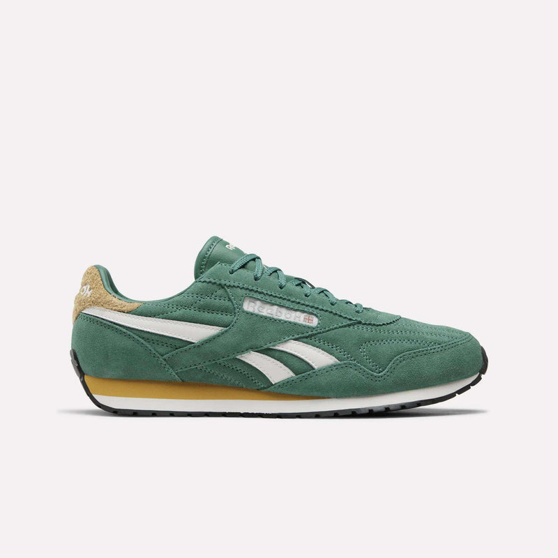 Women’s Classic AZ Shoes by Reebok in Team Green/Chalk/Athletic Gold, featuring suede uppers, white side stripes, tan heel detailing, and a gum sole. These vintage-inspired running sneakers are shown in a side profile view against a plain white background.