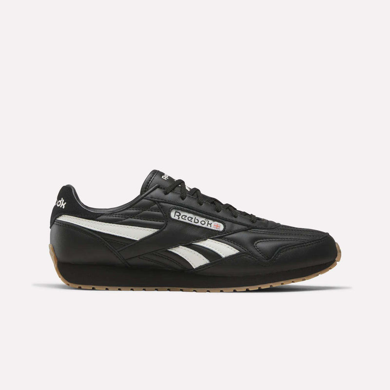 Black Reebok Women’s Classic AZ Shoes in Black/Chalk/Gum, featuring white side stripes and a gum rubber sole, shown in a side view against a plain white background—an iconic choice for women’s footwear.