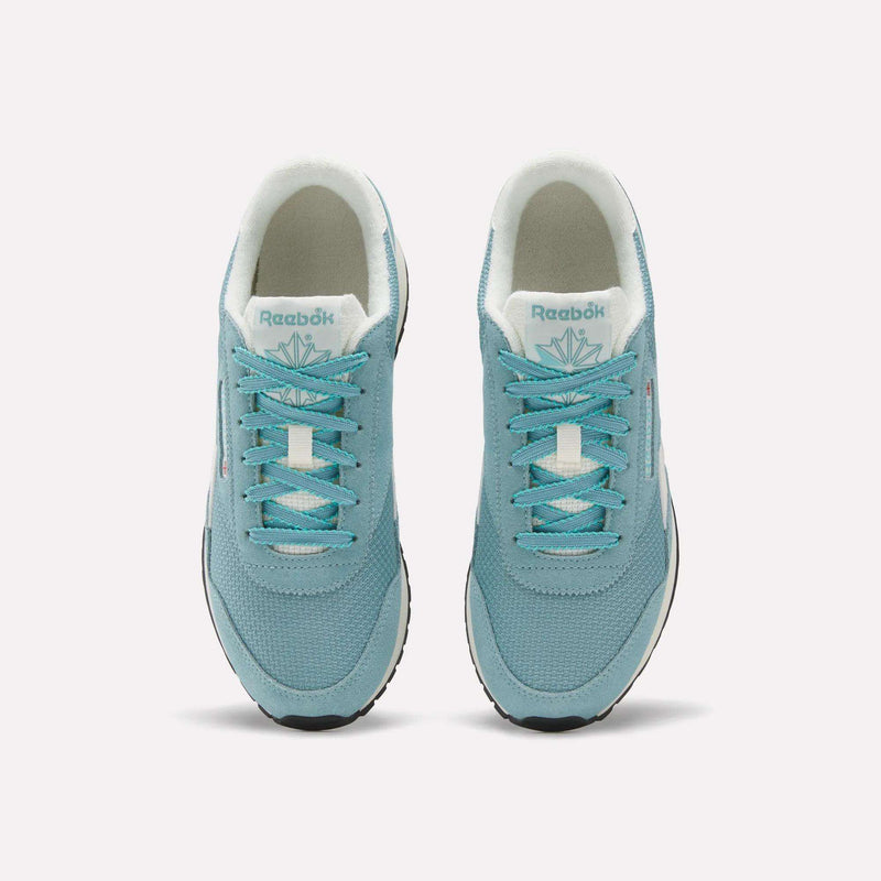 A top-down view of the Reebok Women’s Classic AZ Shoes in light blue, featuring white soles and laces, set against a plain white background.