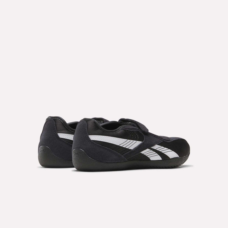 A pair of Women's Ultra Lo Mary Jane Shoes by Reebok is shown from a rear side angle against a plain white background, offering a sleek, low-profile runner look.