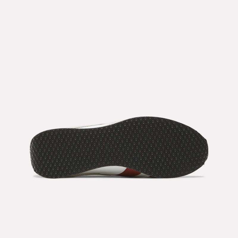 The image shows the bottom view of the Reebok R400 Shoes, featuring a black rubber sole with a repeating hexagonal pattern, a hallmark of many retro sneakers. The rest of the shoe is only partially visible from this angle.