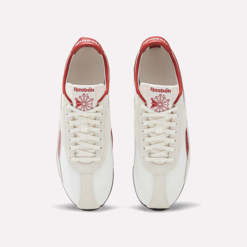 Top view of a pair of Reebok R400 Shoes in white with red accents, featuring white laces and red Reebok logos on the tongue and heel. These vintage Reebok sneakers are placed side by side on a plain background.