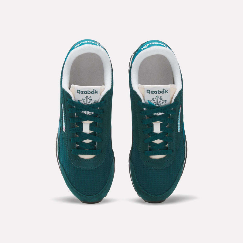 A top view of Women's Classic AZ Shoes by Reebok in green features white laces, branded tongues, and black soles on a plain white background—combining timeless Reebok heritage with retro running style.