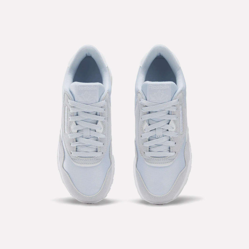 A pair of Reebok Women's Classic Nylon Shoes in white are shown from a top-down view with the laces neatly tied, set against a plain white background.
