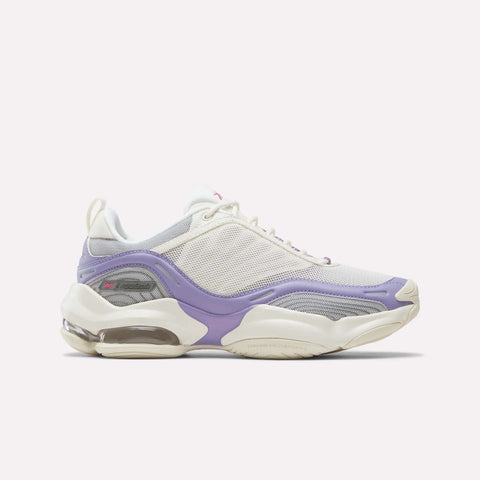 Introducing the Reebok Women’s DMX Series 3000 Shoes, featuring a stylish chalk mesh upper with Blackberry Metallic and True Pink accents. These sneakers are built for comfort with a chunky sole that provides lightweight support and includes visible DMX moving air technology in the heel, delivering an ultra-cushioned, energizing feel with every step.