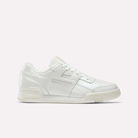 The Women's Workout Plus Shoes by Reebok feature a white low-top design with lace-up closure and subtle stitching, channeling classic 80s fitness style on a plain light background.