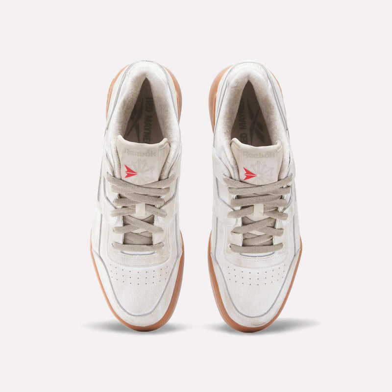Top view of Reebok x Hed Mayner Workout Plus OG Shoes featuring a white leather upper, beige laces, light tan soles, and a red Reebok logo on the tongue, set against a plain light background.