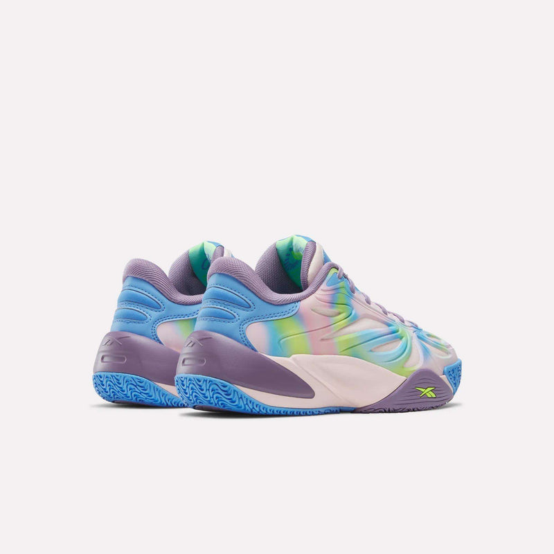 The Angel Reese 1 Shoes - Big Kids by Reebok feature a wavy multicolor upper in blue, purple, green, and pink with neon green logos and a blue sole. Shown from an angled rear view against a plain light background.