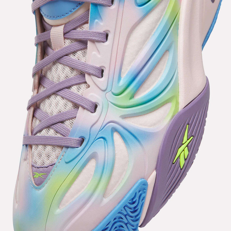 Close-up of Reebok Angel Reese 1 Shoes - Big Kids: pastel purple, blue, green, yellow and lavender laces, mesh fabric, sculpted overlays, and neon green midsole logo—perfect colorful sneakers for kids basketball.