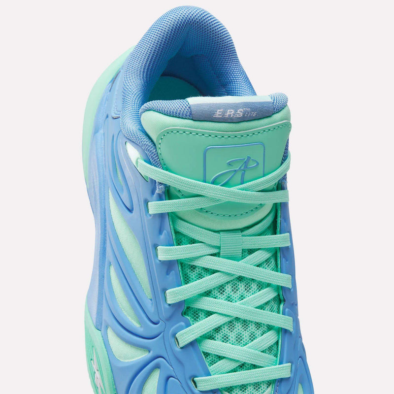 Close-up of Reebok Angel Reese 1 Shoes - Big Kids in aqua blue and mint green, featuring a textured upper, light blue laces, cushioned collar, and sculpted side details—perfect stylish sneakers for young basketball players.