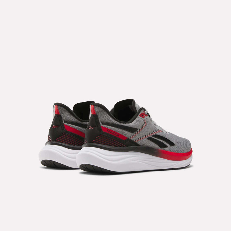 The Reebok Men's Viva Speed Shoes feature a gray, black, and red mesh upper with white soles, displayed from the back and side against a plain white background.