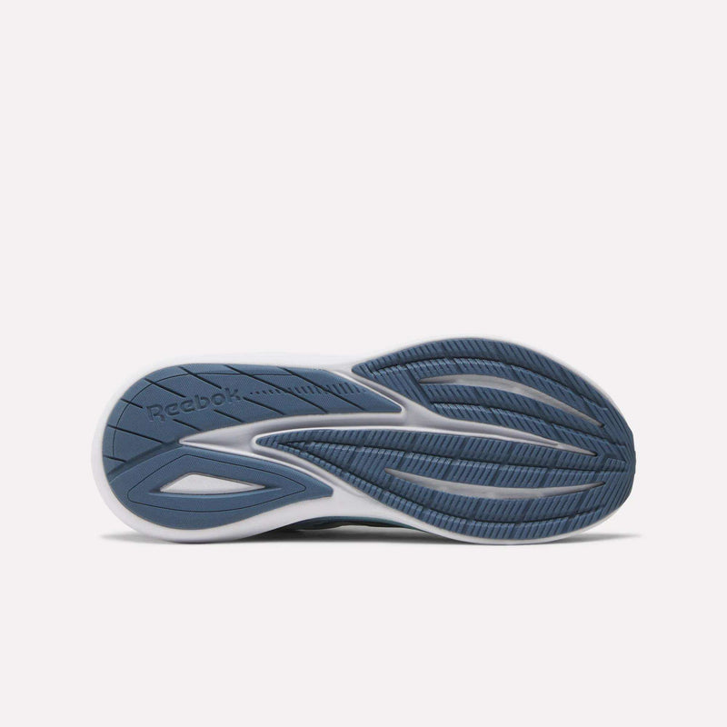 The image displays the sole of Reebok Women's Viva Speed Shoes with a blue and white design, textured and smooth patterns for traction, flexibility, added cushioning, and the Reebok logo on the left side.