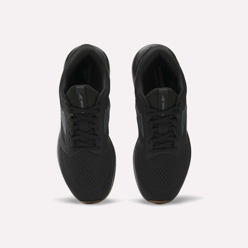 A pair of black Reebok Men's Nanoflex Trainer 2 Shoes viewed from above on a white background, featuring black laces, mesh uppers, and subtle Reebok branding on the tongue and side.