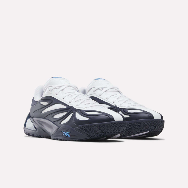 The Reebok Angel Reese 1 Basketball Shoes feature a stylish white upper, dark blue and black wavy overlays, a blue Reebok logo, and the innovative Energy Return System for superior comfort on the court.