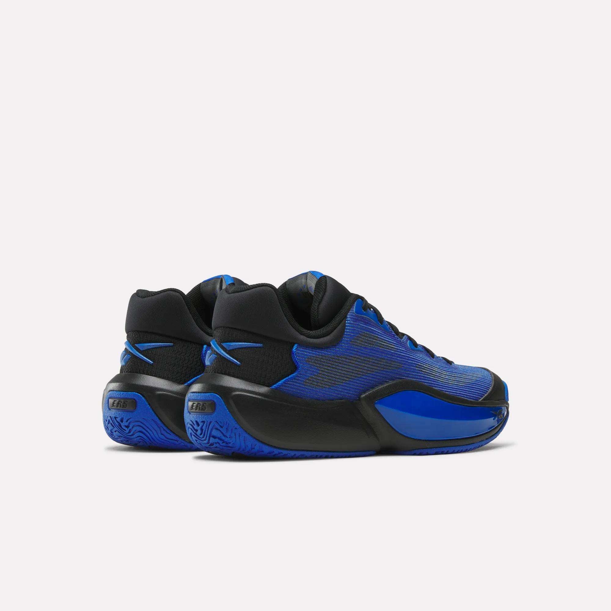 The Reebok Engine A 26 Basketball Shoes, in black and blue with textured blue soles and a modern design, are angled on a plain white background to showcase their stability features from the sides and heels.