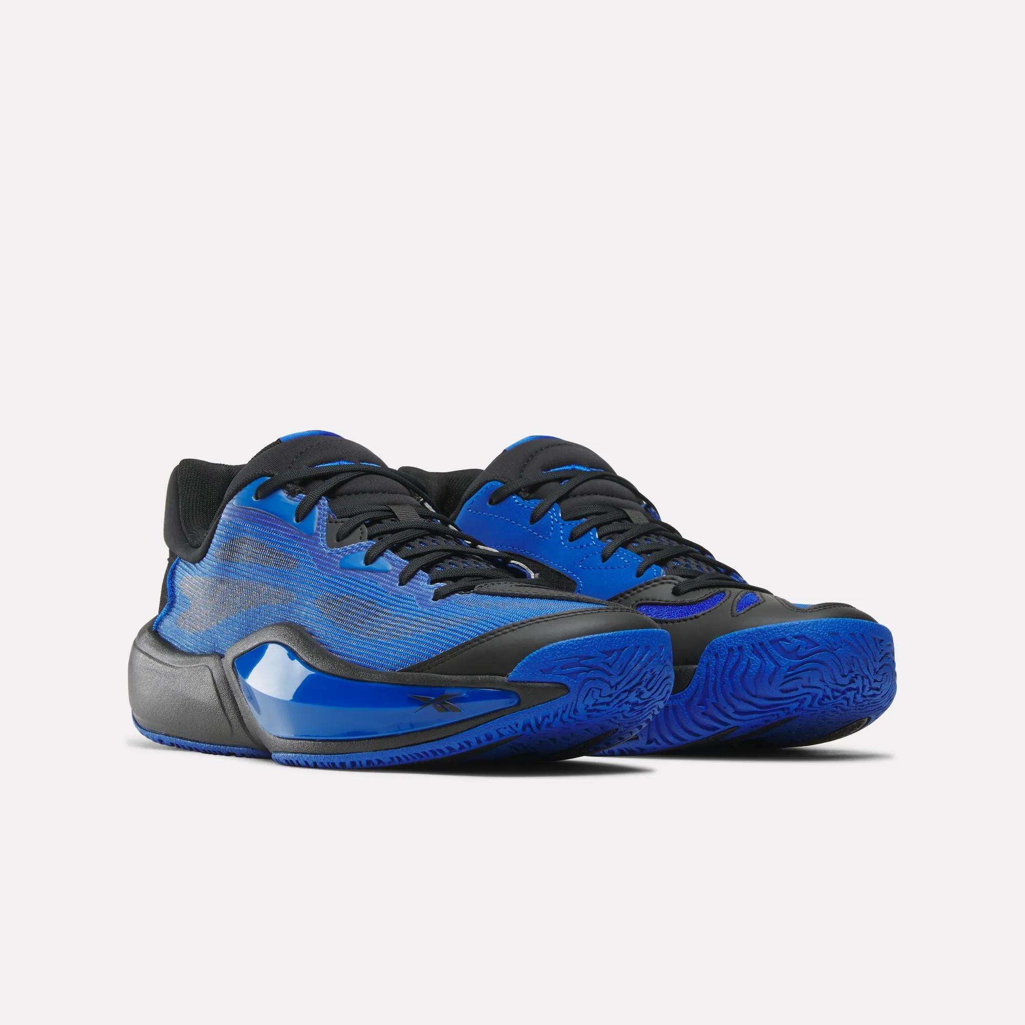 The Reebok Engine A 26 Basketball Shoes feature a blue and black design with textured blue soles and black laces, crafted for stability, shown on a white background.