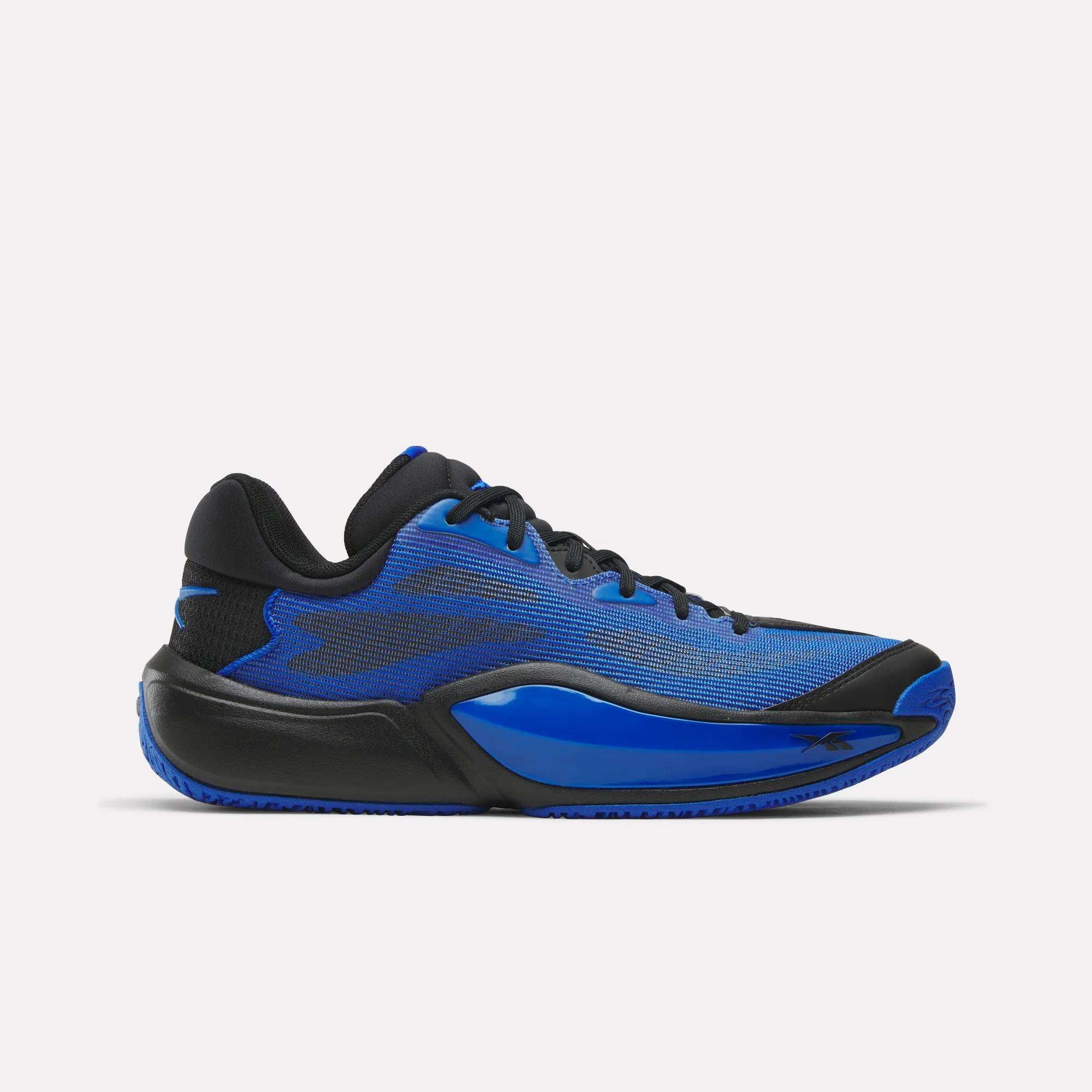 The Reebok Engine A 26 Basketball Shoes are blue and black low-top sneakers with a mesh upper, black sole, and blue accents on the side and midsole for enhanced stability, shown on a white background.