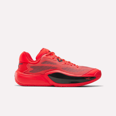 The Reebok Engine A 26 Basketball Shoes feature a bold red, low-profile mesh upper with black accents on the midsole and heel. Inspired by basketball styles, they provide great stability with a textured rubber sole and matching red laces.