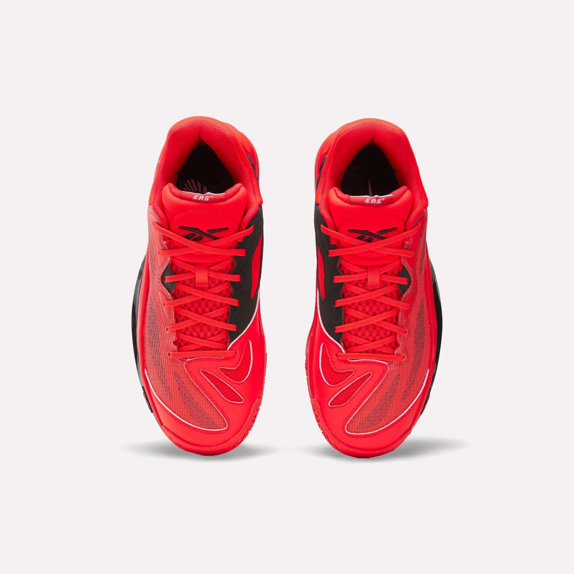 Top view of Reebok Engine A 26 Basketball Shoes in bright red with black and white accents, mesh panels for breathability, energy return cushioning, and the Reebok logo on the tongue, set against a white background.