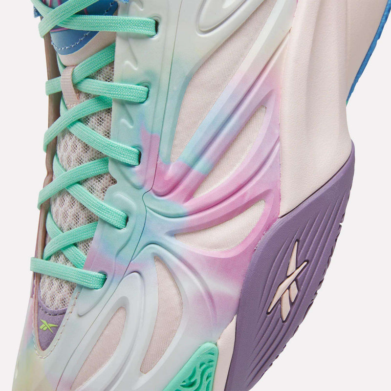 Close-up of the Reebok Angel Reese 1 Basketball Shoes in pastel purple, pink, blue, and green with mint laces and a textured midsole displaying the Reebok logo—featuring the Energy Return System for peak basketball performance.