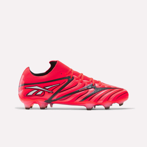 The Reebok Sidewinder 26 Elite Firm Ground Cleats are vibrant red soccer shoes with striking black and white accents, specifically engineered for firm grass surfaces. Featuring a dynamic design and molded studs on the sole to enhance ball control, these cleats are displayed against a plain white background.