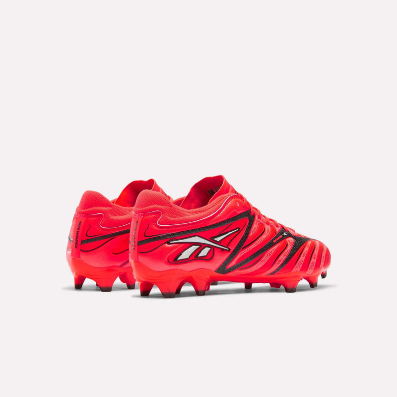 Bright red Reebok Sidewinder 26 Pro Firm Ground Cleats featuring black detailing, black studs, and enhanced ball control.